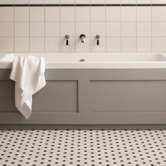 Jet Black Omega Dado (above) Chancel Grey Field Tile (below) Black and White Honeycomb Mosaic (floor)